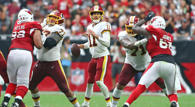 Alex Smith stands behind Redskins offensive line. Redskins_Offensive_Line