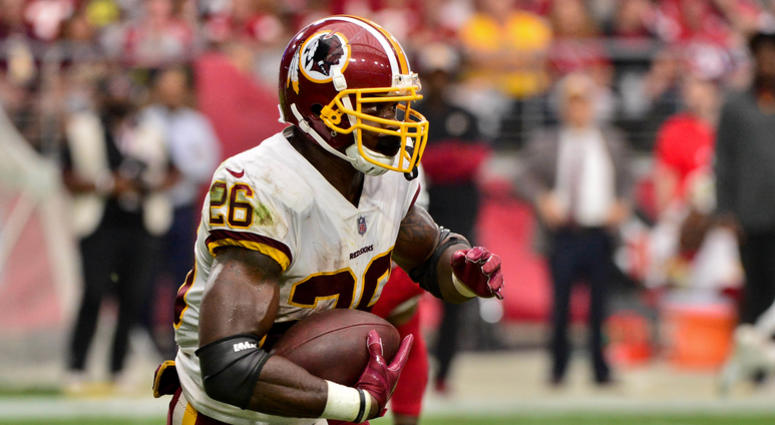 Adrian Peterson carries the ball for the Washington Redskins. Adrian_Peterson
