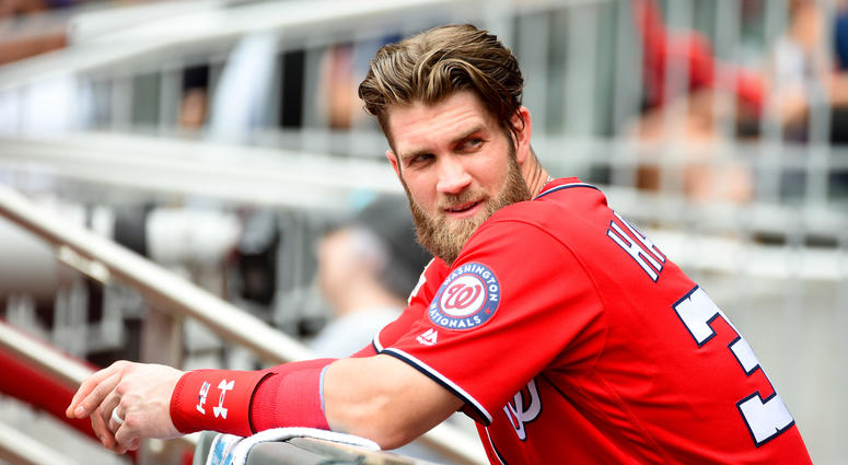 Bryce Harper sits in the Nationals dugout. Bryce_Harper_Dugout