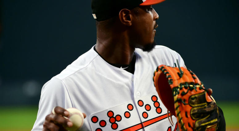 Orioles outfielder Adam Jones wearing a Braille jersey. Adam_Jones_Orioles