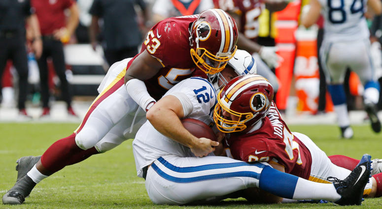 Redskins linebacker Zach Brown tackles Colts quarterback Andrew Luck. Zach_Brown_Andrew_Luck