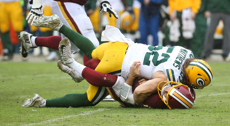 Clay Matthews sacks Alex Smith. Matthews was called for roughing the passer. Clay_Matthews_Alex_Smith