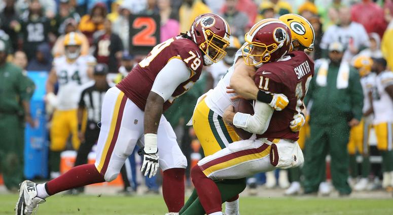 Clay Matthews sacks Redskins QB Alex Smith in the third quarter. Matthews was called for roughing the passer on the play. Clay_Matthews_Alex_Smith_Sack