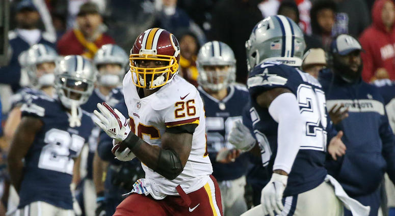 Redskins running back Adrian Peterson runs against the Cowboys. Redskins_Adrian_Peterson