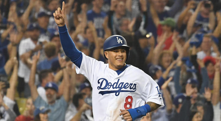 Manny Machado celebrates after scoring on a three-run home run Game 4 of the 2018 World Series. Manny Machado to join Padres, signing largest contract in American sports history