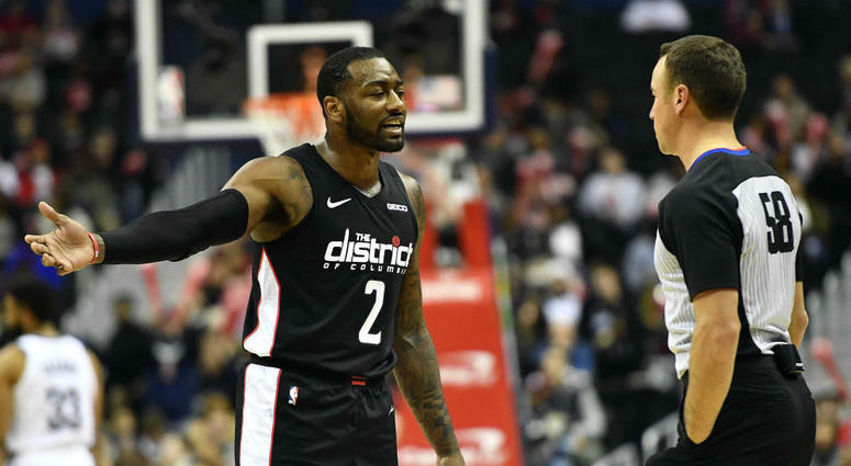 Wizards guard John Wall argues with an NBA referee. Wizards_John_Wall