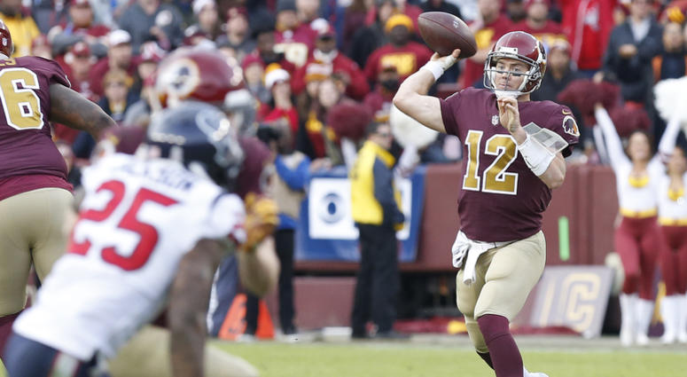 Colt McCoy throws the ball against the Texans in the fourth quarter Colt_McCoy_Redskins
