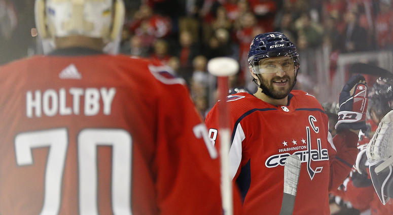 Alex Ovechkin celebrates after scoring a hat trick against the Red Wings