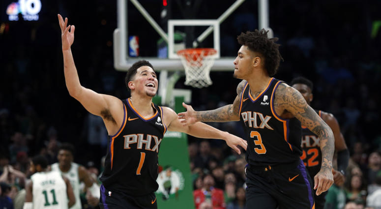 Kelly Oubre celebrates with new Suns teammate Devin Booker Let's all just agree to never talk about the Kelly Oubre trade again