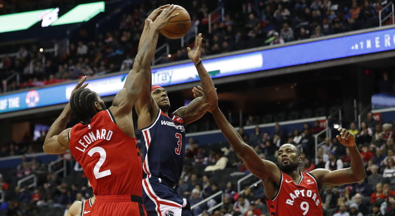 Bradley Beal shoots over the Raptors' Kawhi Leonard and Serge Ibaka. Bradley_Beal_Wizards_Raptors
