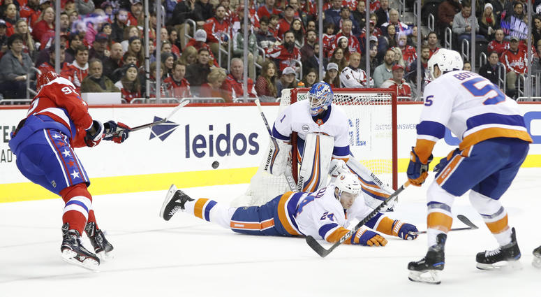 Kuznetsov shoots the puck into a sea of Islanders defenders Alan May: Evgeny Kuznetsov lacks intensity Caps need from him