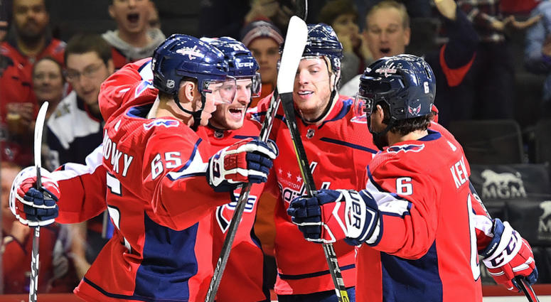 Nic Dowd celebrates a first-period goal with teammates as the Caps return to action against Calgary As 'mental exhaustion' subsides, Caps know how to get back on track