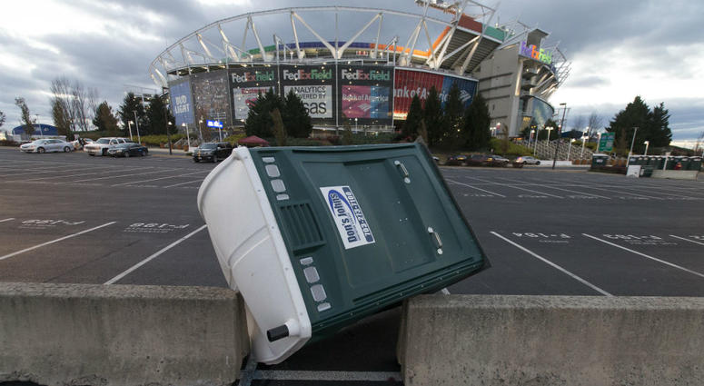 A portable toilet blows over in the wind outside FedEx Field. FedEx_Field_Redskins