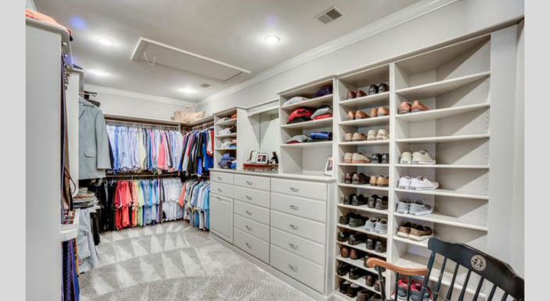 The 'his' closet of master suite inside Bruce Allen's home. Bruce Allen's McLean, Virginia mansion is up for sale again.