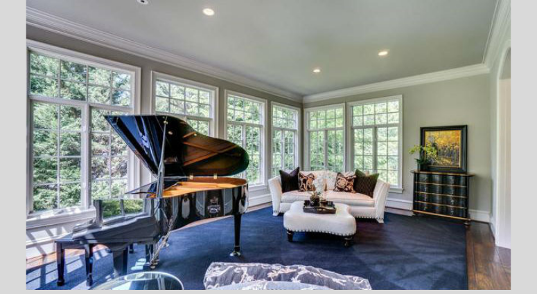 A paino room inside Bruce Allen's home. Bruce Allen's McLean, Virginia mansion is up for sale again.