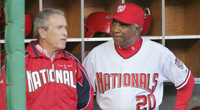 Frank Robinson watches pregame festivities alongside U.S. President George W. Bush prior to the Nationals' inaugural game at RFK Stadium in April 2005 Frank Robinson, Nats' first skipper and MLB's first African-American manager, dead at 83