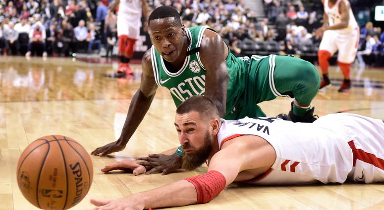 Toronto Raptors center Jonas Valanciunas and Boston Celtics guard Terry Rozier watch the ball get away during the second half of an NBA basketball game Wednesday, April 4, 2018, in Toronto. (Frank Gunn/The Canadian Press via AP) Toronto Raptors center Jonas Valanciunas and Boston Celtics guard Terry Rozier watch the ball get away during the second half of an NBA basketball game Wednesday, April 4, 2018, in Toronto. (Frank Gunn/The Canadian Press via AP)