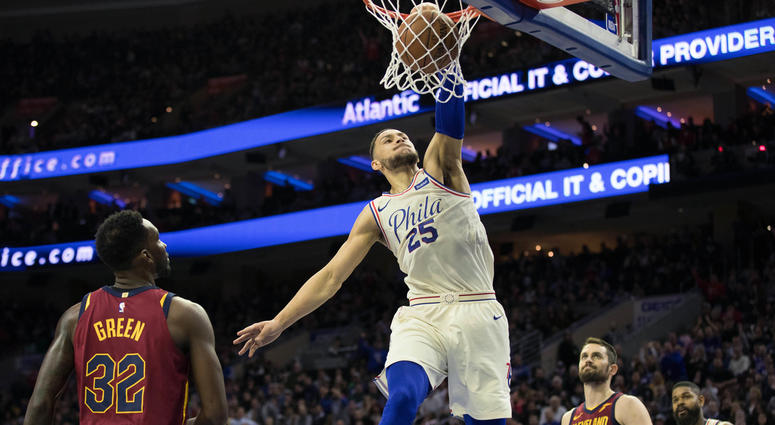 Philadelphia 76ers guard Ben Simmons (25) dunks past Cleveland Cavaliers forward Jeff Green (32) and center Kevin Love (0) during the second quarter at Wells Fargo Center. Philadelphia 76ers guard Ben Simmons (25) dunks past Cleveland Cavaliers forward Jeff Green (32) and center Kevin Love (0) during the second quarter at Wells Fargo Center
