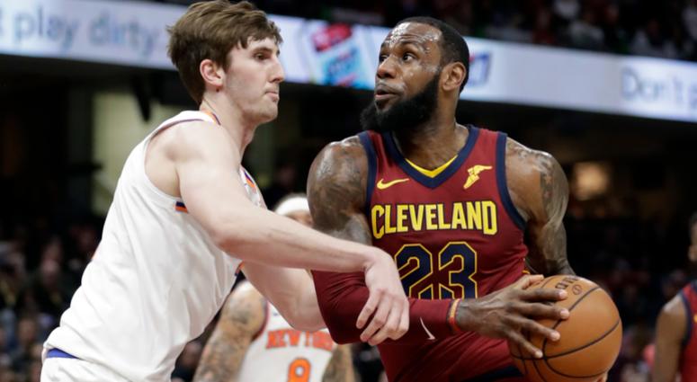 Cleveland Cavaliers' LeBron James, right, drivers past New York Knicks' Luke Kornet, from Switzerland, in the first half of an NBA basketball game, Wednesday, April 11, 2018, in Cleveland. Cleveland Cavaliers' LeBron James, right, drivers past New York Knicks' Luke Kornet, from Switzerland, in the first half of an NBA basketball game, Wednesday, April 11, 2018, in Cleveland.