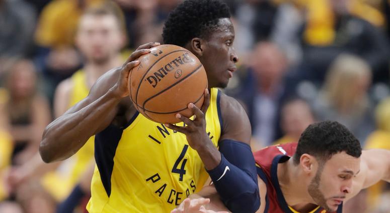 Indiana Pacers' Victor Oladipo (4) grabs a loose ball next to Cleveland Cavaliers' Larry Nance Jr. during the first half of Game 3 of a first-round NBA basketball playoff series Friday, April 20, 2018, in Indianapolis Indiana Pacers' Victor Oladipo (4) grabs a loose ball next to Cleveland Cavaliers' Larry Nance Jr. during the first half of Game 3 of a first-round NBA basketball playoff series Friday, April 20, 2018, in Indianapolis