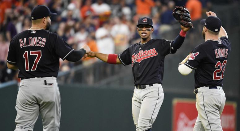 Cleveland Indians' Yonder Alonso (17), Francisco Lindor, center, and Jason Kipnis celebrate their win over the Houston Astros in a baseball game, Saturday, May 19, 2018, in Houston. Cleveland Indians' Yonder Alonso (17), Francisco Lindor, center, and Jason Kipnis celebrate their win over the Houston Astros in a baseball game, Saturday, May 19, 2018, in Houston.