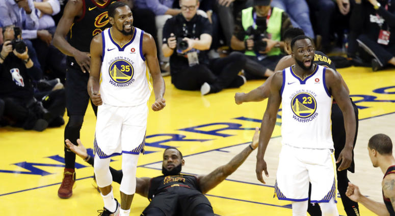 Cleveland Cavaliers forward LeBron James (23) reacts between guard Jordan Clarkson (8) and Golden State Warriors forward Kevin Durant during the second half of Game 1 of basketball's NBA Finals in Oakland, Calif., Thursday, May 31, 2018. Cleveland Cavaliers forward LeBron James (23) reacts between guard Jordan Clarkson (8) and Golden State Warriors forward Kevin Durant during the second half of Game 1 of basketball's NBA Finals in Oakland, Calif., Thursday, May 31, 2018.