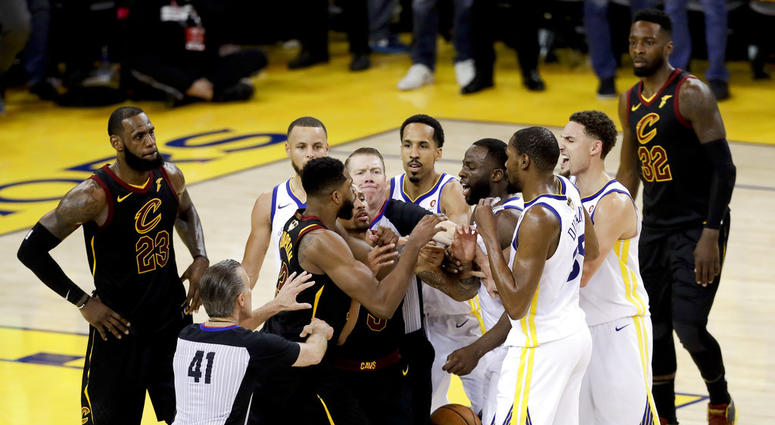 An official tries to separate Cleveland Cavaliers center Tristan Thompson and Golden State Warriors forward Draymond Green during overtime of Game 1 of basketball's NBA Finals in Oakland, Calif., Thursday, May 31, 2018. The Warriors won 124-114. An official tries to separate Cleveland Cavaliers center Tristan Thompson and Golden State Warriors forward Draymond Green during overtime of Game 1 of basketball's NBA Finals in Oakland, Calif., Thursday, May 31, 2018. The Warriors won 124-114.