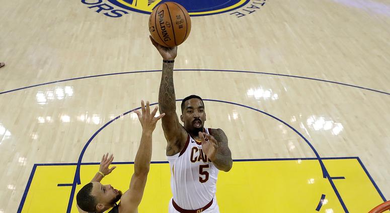 Cleveland Cavaliers guard J.R. Smith (5) shoots against Golden State Warriors guard Stephen Curry (30) and center JaVale McGee during the first half of Game 2 of basketball's NBA Finals in Oakland, Calif., Sunday, June 3, 2018 Cleveland Cavaliers guard J.R. Smith (5) shoots against Golden State Warriors guard Stephen Curry (30) and center JaVale McGee during the first half of Game 2 of basketball's NBA Finals in Oakland, Calif., Sunday, June 3, 2018