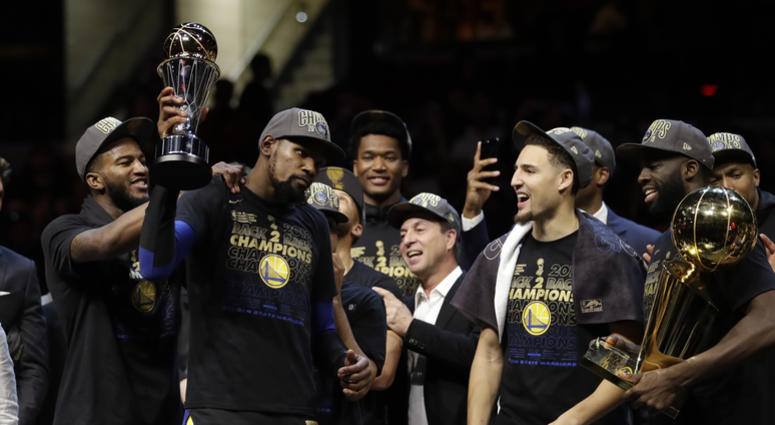 Golden State Warriors' Kevin Durant, second from left, celebrates after the Warriors defeated the Cleveland Cavaliers 108-85 in Game 4 of basketball's NBA Finals to win the NBA championship, Friday, June 8, 2018, in Cleveland. Golden State Warriors' Kevin Durant, second from left, celebrates after the Warriors defeated the Cleveland Cavaliers 108-85 in Game 4 of basketball's NBA Finals to win the NBA championship, Friday, June 8, 2018, in Cleveland.