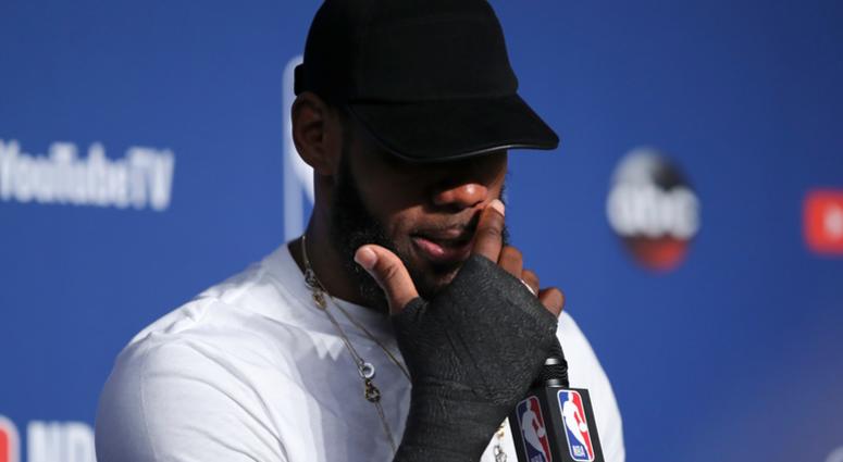 Cleveland Cavaliers forward LeBron James wipes his face during a news conference following Game 4 of basketball's NBA Finals against the Golden State Warriors, early Saturday, June 9, 2018, in Cleveland Cleveland Cavaliers forward LeBron James wipes his face during a news conference following Game 4 of basketball's NBA Finals against the Golden State Warriors, early Saturday, June 9, 2018, in Cleveland