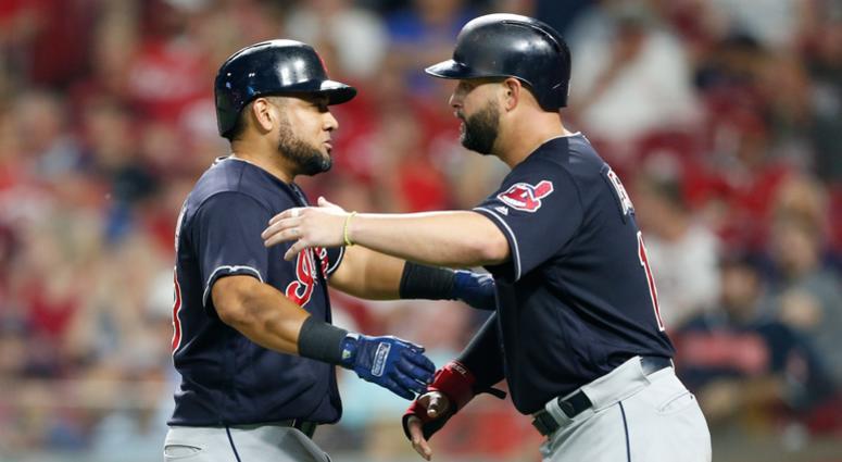 Cleveland Indians' Melky Cabrera, left, gets a hug from Yonder Alonso following Cabrera's a two-run home run off Cincinnati Reds relief pitcher Cody Reed during the sixth inning of a baseball game Wednesday, Aug. 15, 2018, in Cincinnati. Cleveland Indians' Melky Cabrera, left, gets a hug from Yonder Alonso following Cabrera's a two-run home run off Cincinnati Reds relief pitcher Cody Reed during the sixth inning of a baseball game Wednesday, Aug. 15, 2018, in Cincinnati.