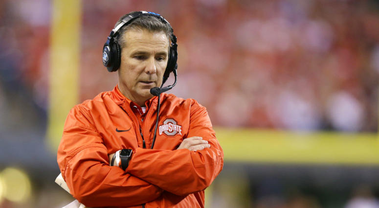 In this Dec. 2, 2017, file photo, Ohio State coach Urban Meyer stands along the sideline during the first half of the team's Big Ten championship NCAA college football game against Wisconsin in Indianapolis. The investigation of how Meyer handled domestic In this Dec. 2, 2017, file photo, Ohio State coach Urban Meyer stands along the sideline during the first half of the team's Big Ten championship NCAA college football game against Wisconsin in Indianapolis. The investigation of how Meyer handled domestic