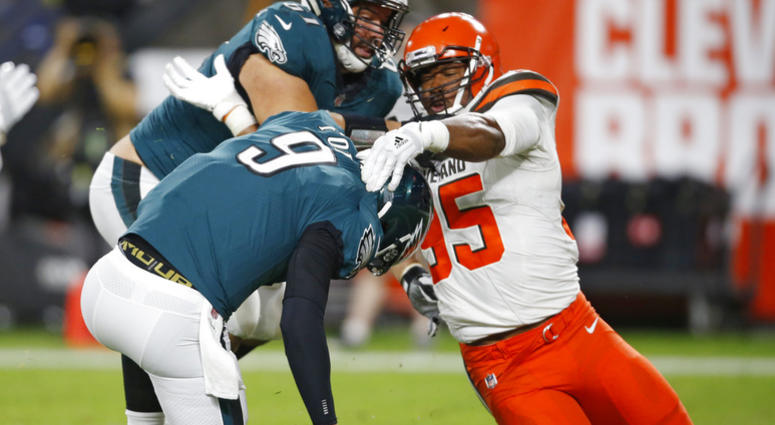 Cleveland Browns defensive end Myles Garrett (95) takes down Philadelphia Eagles quarterback Nick Foles (9) for a safety during the first half of an NFL preseason football game Thursday, Aug. 23, 2018, in Cleveland. Cleveland Browns defensive end Myles Garrett (95) takes down Philadelphia Eagles quarterback Nick Foles (9) for a safety during the first half of an NFL preseason football game Thursday, Aug. 23, 2018, in Cleveland. (AP Photo/Ron Schwane)