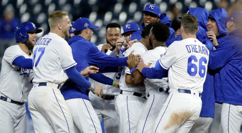 Kansas City Royals mob designated hitter Salvador Perez after he drove in the winning run during the 10th inning of a baseball game against the Cleveland Indians at Kauffman Stadium in Kansas City, Mo., Thursday, Sept. 27, 2018. The Royals defeated the In Kansas City Royals mob designated hitter Salvador Perez after he drove in the winning run during the 10th inning of a baseball game against the Cleveland Indians at Kauffman Stadium in Kansas City, Mo., Thursday, Sept. 27, 2018. The Royals defeated the In