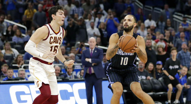 Orlando Magic's Evan Fournier (10) prepares to go up for a shot just before the buzzer as Cleveland Cavaliers' Cedi Osman, left, tries to defend as Orlando defeated Cleveland in an NBA basketball game, Monday, Nov. 5, 2018, in Orlando, Fla. (AP Photo/John Orlando Magic's Evan Fournier (10) prepares to go up for a shot just before the buzzer as Cleveland Cavaliers' Cedi Osman, left, tries to defend as Orlando defeated Cleveland in an NBA basketball game, Monday, Nov. 5, 2018, in Orlando, Fla. (AP Photo/John