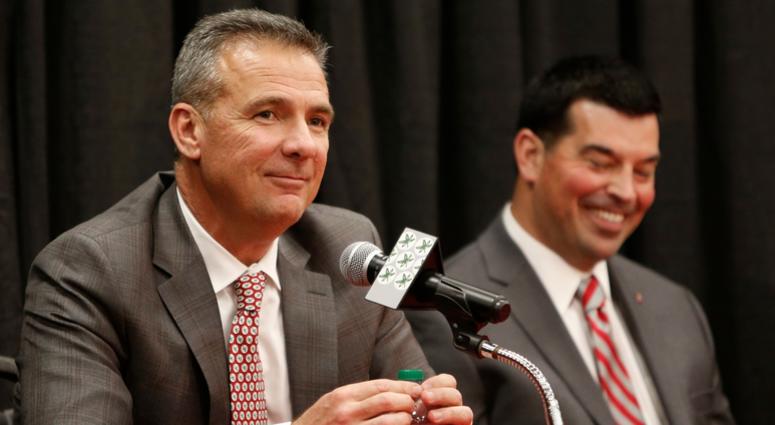 Ohio State NCAA college football head coach Urban Meyer, left, answers questions during a news conference announcing his retirement Tuesday, Dec. 4, 2018, in Columbus, Ohio. At right is assistant coach Ryan Day. Ohio State NCAA college football head coach Urban Meyer, left, answers questions during a news conference announcing his retirement Tuesday, Dec. 4, 2018, in Columbus, Ohio. At right is assistant coach Ryan Day.