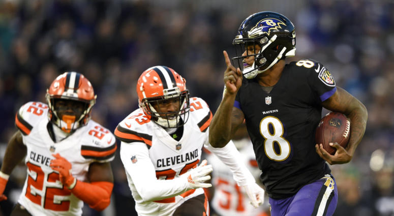 Baltimore Ravens quarterback Lamar Jackson, right, rushes for a touchdown past Cleveland Browns free safety Jabrill Peppers, back left, and strong safety Damarious Randall in the first half of an NFL football game, Sunday, Dec. 30, 2018, in Baltimore. (AP Baltimore Ravens quarterback Lamar Jackson, right, rushes for a touchdown past Cleveland Browns free safety Jabrill Peppers, back left, and strong safety Damarious Randall in the first half of an NFL football game, Sunday, Dec. 30, 2018, in Baltimore. (AP