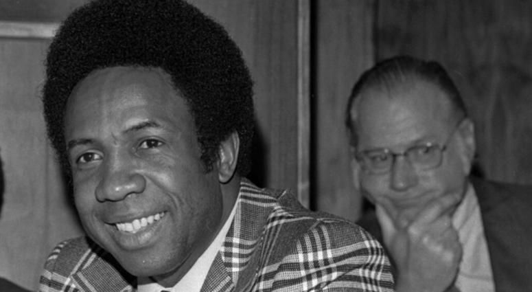 his June 19, 1996, file photo shows Frank Robinson at a news conference in Cleveland, Ohio, after being named Major League Baseball's first black manager, with the Cleveland Indians. In the background is baseball commissioner Bowie Kuhn. Hall of Famer Fra his June 19, 1996, file photo shows Frank Robinson at a news conference in Cleveland, Ohio, after being named Major League Baseball's first black manager, with the Cleveland Indians. In the background is baseball commissioner Bowie Kuhn. Hall of Famer Fra