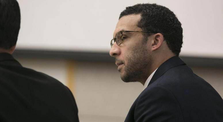 Former NFL football player Kellen Winslow Jr. looks at attorney Marc Carlos during his rape trial, Monday, May 20, 2019, in Vista, Calif.