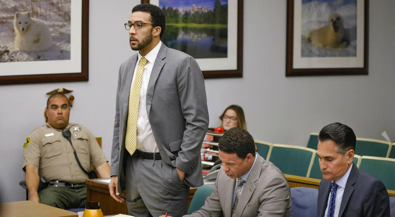 Ex-NFL player Kellen Winslow II, standing, answers a question from San Diego County Superior Court Vista Judge Blaine Bowman during a status hearing Friday, June 14, 2019 in Vista, Calif.