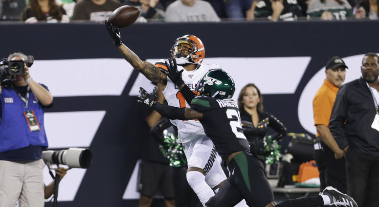 Cleveland Browns' Odell Beckham (13) catches a pass in front of New York Jets' Nate Hairston (21) during the first half of an NFL football game Monday, Sept. 16, 2019, in East Rutherford, N.J.
