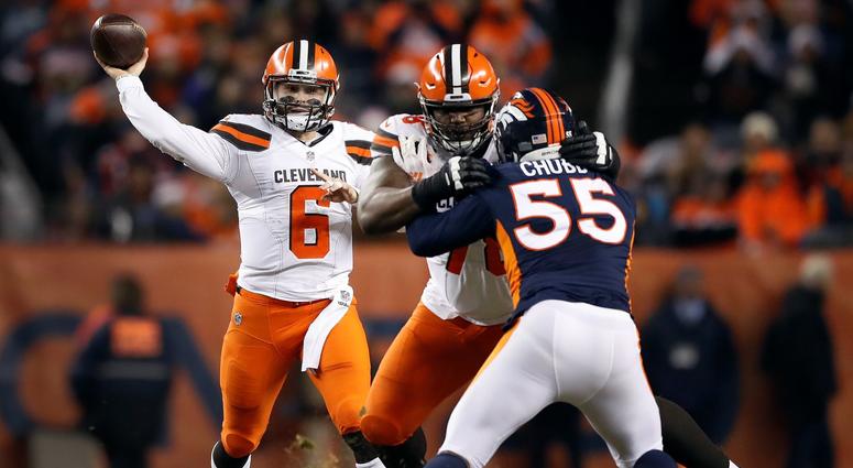 Cleveland Browns quarterback Baker Mayfield (6) throws as Denver Broncos outside linebacker Bradley Chubb (55) pursues during the second half of an NFL football game, Saturday, Dec. 15, 2018, in Denver.