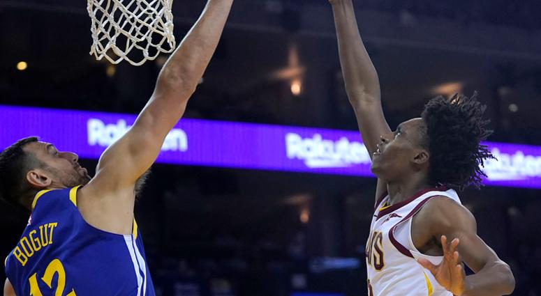 Cleveland Cavaliers guard Collin Sexton (2) drives to the basket against Golden State Warriors center Andrew Bogut (12) during the second half of an NBA basketball game Friday, April 5, 2019, in Oakland, Calif.