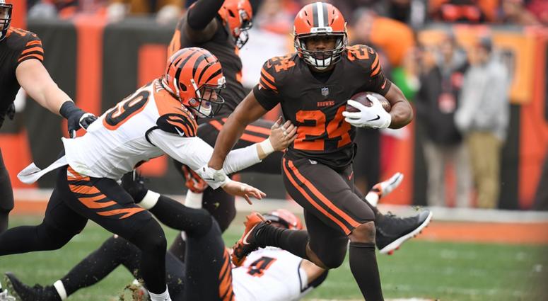 CLEVELAND, OH - DECEMBER 23: Nick Chubb #24 of the Cleveland Browns carries the ball in front of Nick Vigil #59 of the Cincinnati Bengals during the first half at FirstEnergy Stadium on December 23, 2018 in Cleveland, Ohio. (Photo by Jason Miller/Getty Im CLEVELAND, OH - DECEMBER 23: Nick Chubb #24 of the Cleveland Browns carries the ball in front of Nick Vigil #59 of the Cincinnati Bengals during the first half at FirstEnergy Stadium on December 23, 2018 in Cleveland, Ohio. (Photo by Jason Miller/Getty Im