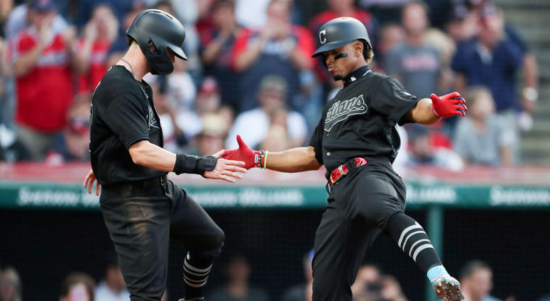 Francisco Lindor #12 of the Cleveland Indians celebrates with Tyler Naquin #30 after hitting a two run home run off starting pitcher Jakob Junis #65 of the Kansas City Royals during the second inning at Progressive Field on August 23, 2019 in Cleveland. Tyler Naquin and Francisco Lindor