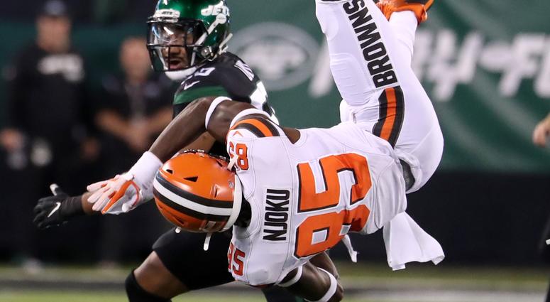 David Njoku #85 of the Cleveland Browns falls after failing to make a catch in the first quarter against Frankie Luvu #50 of the New York Jets at MetLife Stadium on September 16, 2019 in East Rutherford, New Jersey.