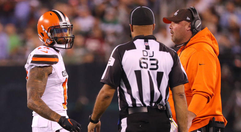 Odell Beckham #13 of the Cleveland Browns speaks to back judge Jim Quirk #63 as he's told to leave the field for a play in the first quarter as head coach Freddie Kitchens looks on at MetLife Stadium on September 16, 2019