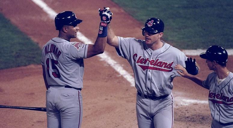 18 Oct 1997: First baseman Jim Thome and catcher Sandy Alomar of the Cleveland Indians high five each other during game one of the World Series against the Florida Marlins at Pro Player Park in Miami, Florida. The Marlins won the game 7-4. 18 Oct 1997: First baseman Jim Thome and catcher Sandy Alomar of the Cleveland Indians high five each other during game one of the World Series against the Florida Marlins at Pro Player Park in Miami, Florida. The Marlins won the game 7-4.