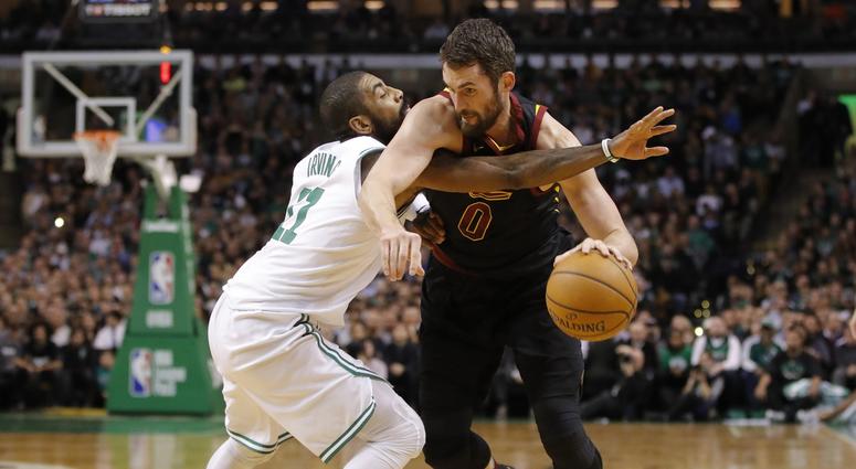 Jan 3, 2018; Boston, MA, USA; Cleveland Cavaliers forward Kevin Love (0) drives the ball against Boston Celtics guard Kyrie Irving (11) in the first quarter at TD Garden.