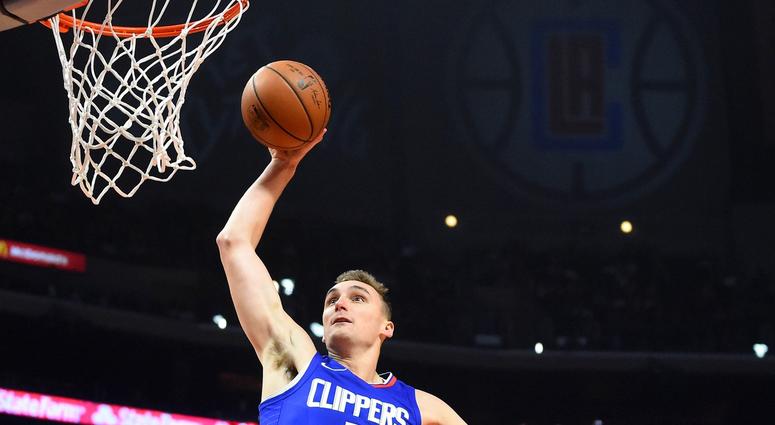 Los Angeles Clippers forward Sam Dekker (7) dunks the ball in the first half of the game against the Sacramento Kings at Staples Center. Los Angeles Clippers forward Sam Dekker (7) dunks the ball in the first half of the game against the Sacramento Kings at Staples Center.